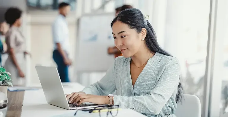 person typing on laptop